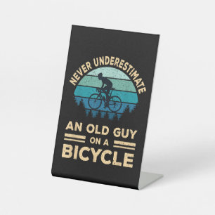 Never Underestimate An Old Guy On A Bicycle Funny Pedestal Sign