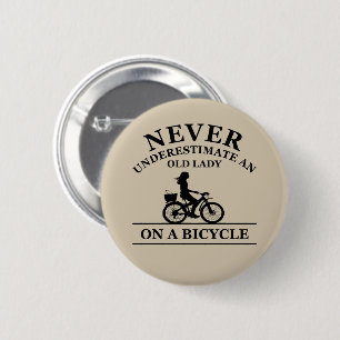 Never underestimate an old lady on a bicycle  6 cm round badge