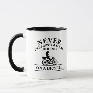 Never underestimate an old lady on a bicycle  mug