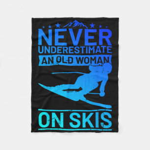 Never Underestimate An Old Woman On Skis Women's S Fleece Blanket