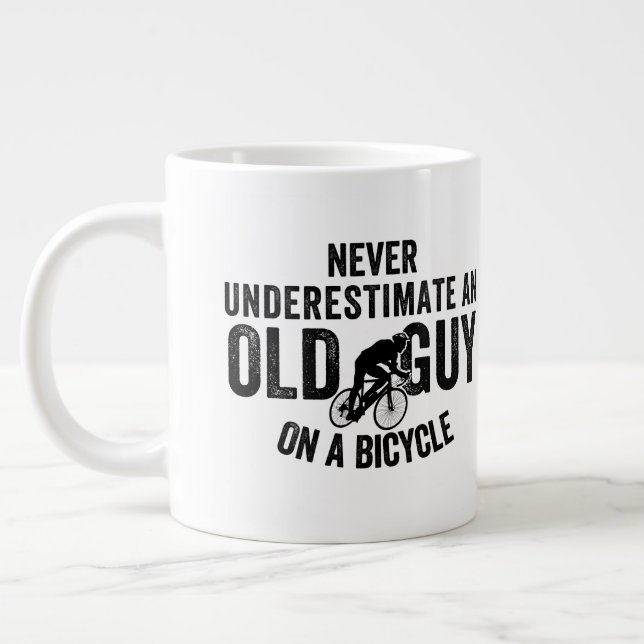 Never Underestimate Old Guy On Bicycle Coffee Mug (Left)