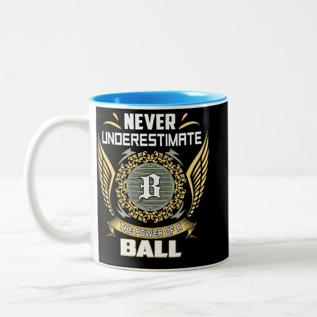 Never Underestimate The Power Of A Ball Two-Tone Coffee Mug (Left)
