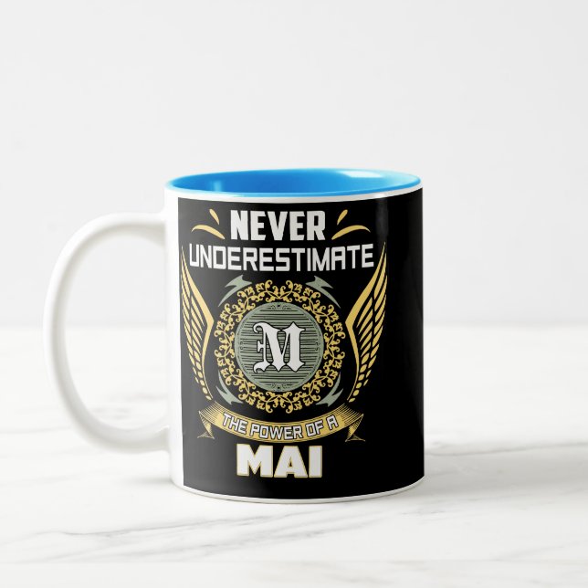 Never Underestimate The Power Of A Mai Two-Tone Coffee Mug (Left)