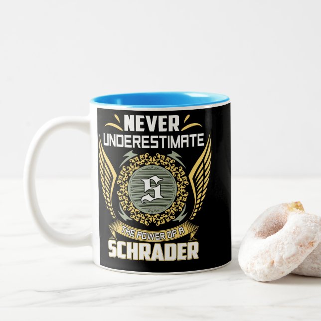 Never Underestimate The Power Of A Schrader Two-Tone Coffee Mug (With Donut)