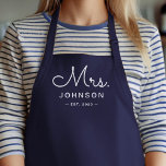 Newlywed Bride Personalised Blue Apron<br><div class="desc">For the bride and groom, this navy blue apron features "Mrs." in a modern script font along with a last name and established date. This is a perfect bridal shower or wedding gift. These Mrs. and Mr. aprons are available in a variety of colours and can be also customised to...</div>