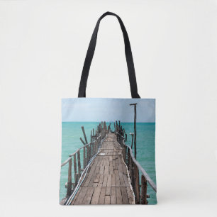 Nice wooden bridge with blue sea background at Sam Tote Bag