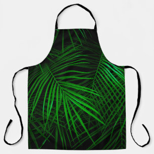Night in tropical rainforest. Palm leaves lit with Apron