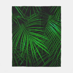 Night in tropical rainforest. Palm leaves lit with Fleece Blanket