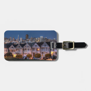 Night view of 'painted ladies'  houses luggage tag