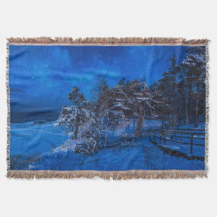Nighttime winter scene with snow covered pines throw blanket