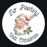 No peeking until Christmas fun pink Santa Classic Round Sticker<br><div class="desc">No peeking until Christmas featuring a smiling Santa with a pink hat.</div>