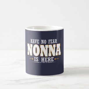 NONNA IS HERE COFFEE MUG