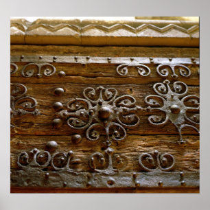 Norman iron scroll work on wooden door poster