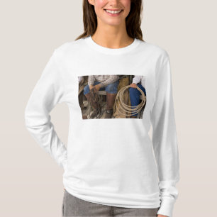 North America, USA. Cowboys relaxing and 2 T-Shirt