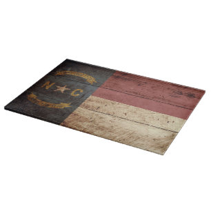 North Carolina State Flag on Old Wood Grain Cutting Board