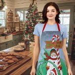 North Pole Snowman Dragon Penguin Christmas Apron<br><div class="desc">A cute penguin giving a green dragon a Christmas present,  A snowman with a North Pole candy cane sign in a backdrop of falling snow</div>