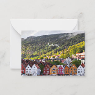 Norwegian town with mountains in the background card