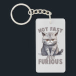 Not Fast, Just Furious – Grey Cat Humour Key Ring<br><div class="desc">Unleash your inner sass with this 'Not Fast, Just Furious' keychain! Featuring a grumpy grey cat with an attitude, this hilarious artwork is perfect for cat lovers who appreciate a touch of humour. A fun and quirky gift for feline enthusiasts, this design is ideal for anyone who knows that speed...</div>