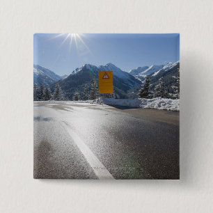 notice board on a winter road, snow covered 2 15 cm square badge