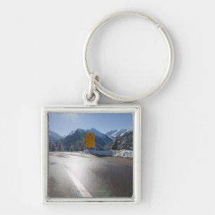 notice board on a winter road, snow covered 2 key ring