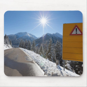 notice board on a winter road, snow covered mouse pad