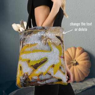November forest: Yellow leaves beneath the snow Tote Bag