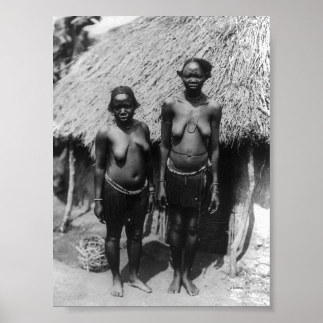 Nubian Women Standing in front of Hut Poster (Front)
