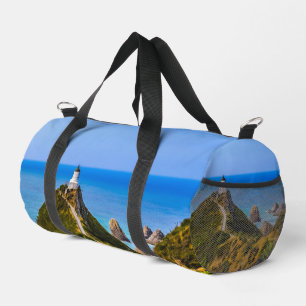 Nugget Point lighthouse, New Zealand Duffle Bag