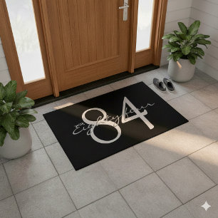 Numerical and text on black background doormat