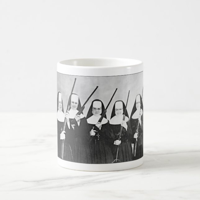 NUNS WITH GUNS COFFEE MUG. MUG (Center)