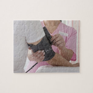 Nurse taking patient's blood pressure jigsaw puzzle