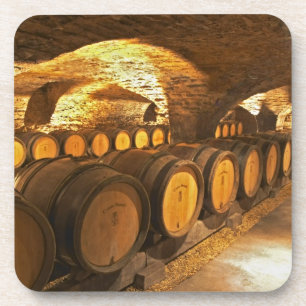 Oak barrles in the cellar at Domaine Comte Coaster