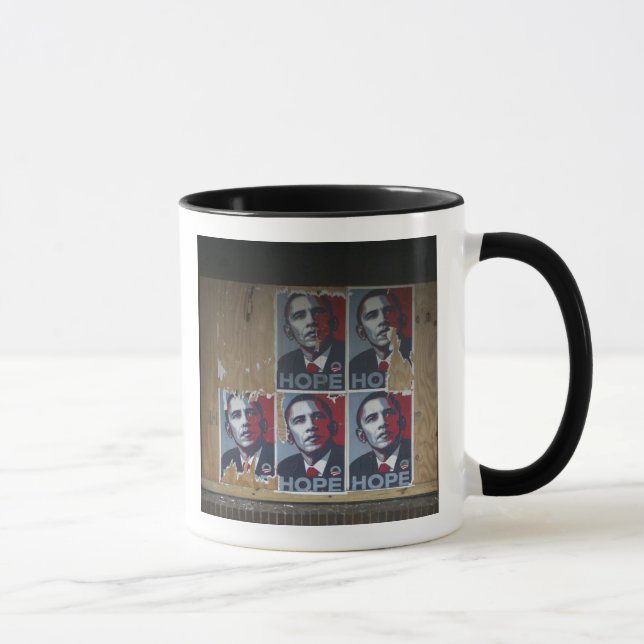 Obama signs in a boarded window of a closed mug (Right)