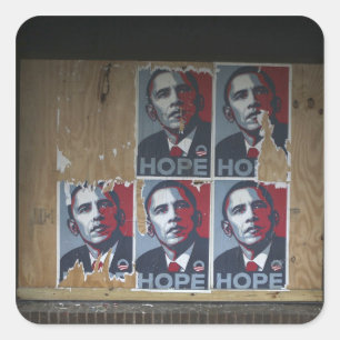 Obama signs in a boarded window of a closed square sticker