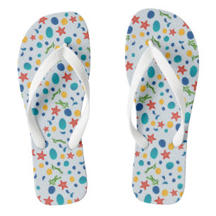 Ocean beach with starfish, shells and pebbles thongs