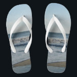 Ocean Waves Blue Sky Beach Sand Thongs<br><div class="desc">Pretty Blue Sky with Light Fluffy White Clouds, Blue Sea, Crashing Ocean Waves and Beach Sand Unisex Flip Flops. Shown with Wide White Straps and White Footbed. See options for flip flops in Slim Straps for more strap colours. Perfect for your summertime fun, trips to the beach, vacations, honeymoon or...</div>