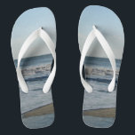 Ocean Waves Blue Sky Beach Sand Thongs<br><div class="desc">Pretty Blue Sky with Light Fluffy White Clouds, Blue Sea, Crashing Ocean Waves and Beach Sand Unisex Flip Flops. Shown with Wide White Straps and White Footbed. See options for flip flops in Slim Straps for more strap colours. Perfect for your summertime fun, trips to the beach, vacations, honeymoon or...</div>