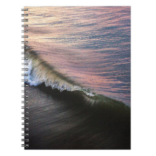 OCEAN WAVES CRASHING ON SHORE DURING DAYTIME NOTEBOOK