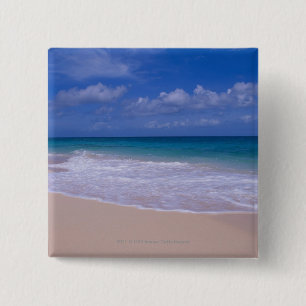 Ocean waves foaming onto sandy beach 15 cm square badge