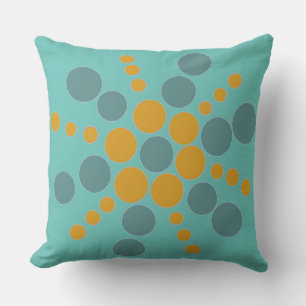 Ochre and blue dotted star on teal cushion