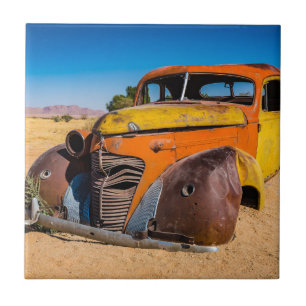 Old and abandoned car in Solitaire, Namibia Ceramic Tile