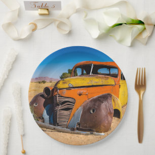 Old and abandoned car in Solitaire, Namibia Paper Plate