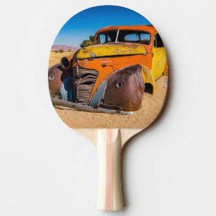 Old and abandoned car in Solitaire, Namibia Ping Pong Paddle