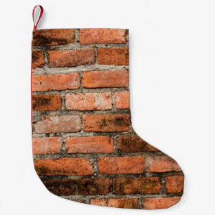 Old and vintage red brick wall texture backgrounda small christmas stocking