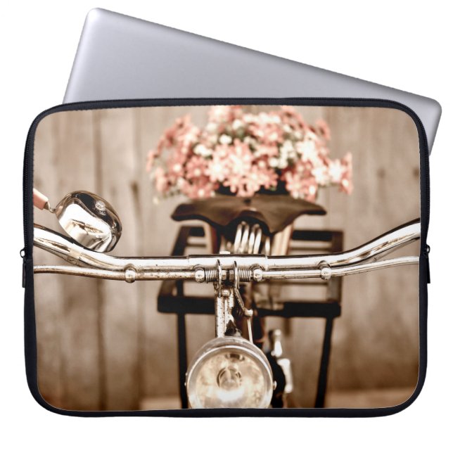Old bicycle and flowers blur in background process laptop sleeve (Front)