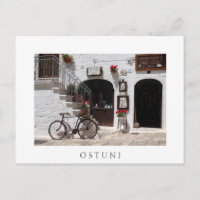 Old bike and storefront in Apulia