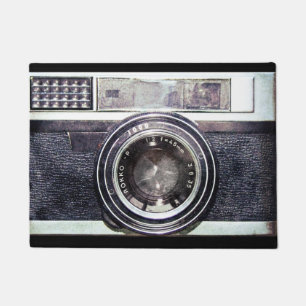 Old black camera doormat