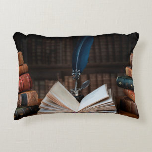 Old books, quill pen and vintage inkwell on wooden decorative cushion