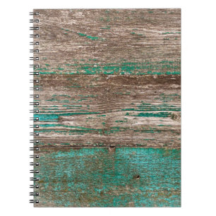 Old brown-blue wooden background with peeling pain notebook
