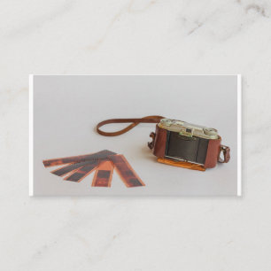old camera with negative on   business card